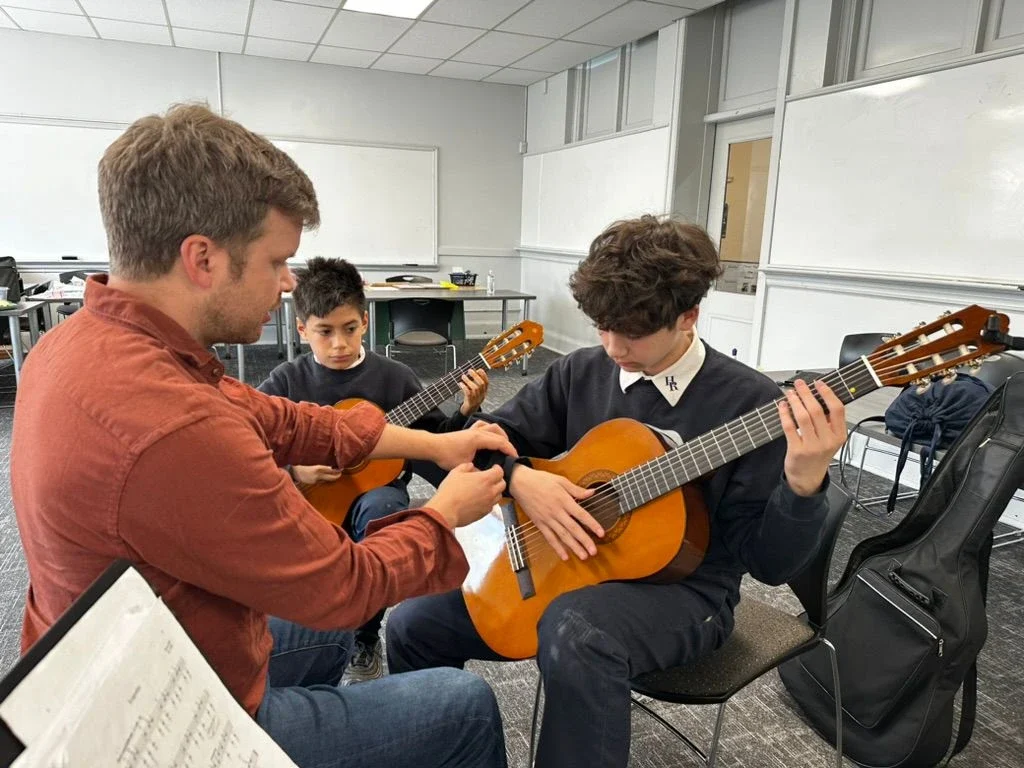 Co-Founder, Matthew, Rohde, working with new Detroit students at Holy Redeemer