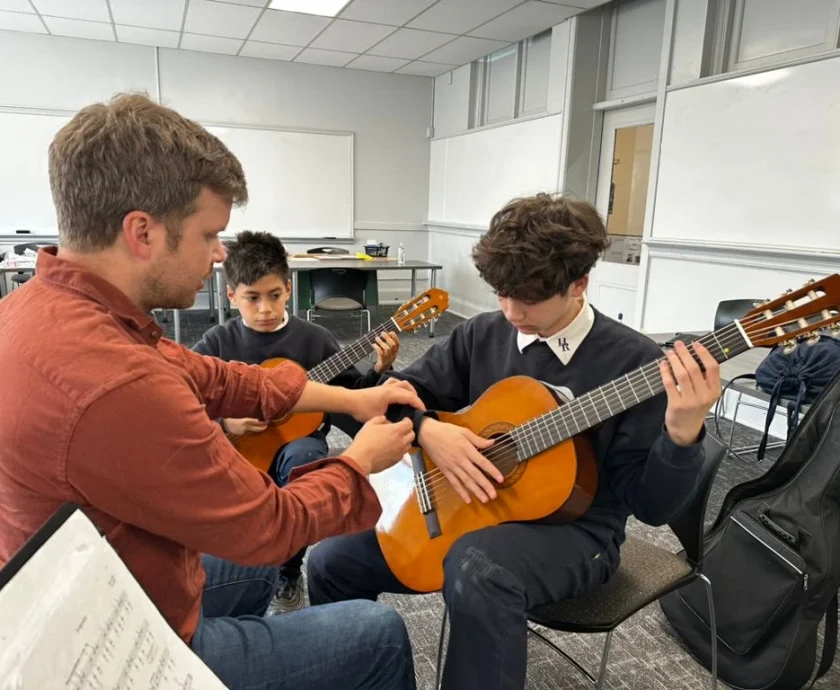 Co-Founder, Matthew, Rohde, working with new Detroit students at Holy Redeemer