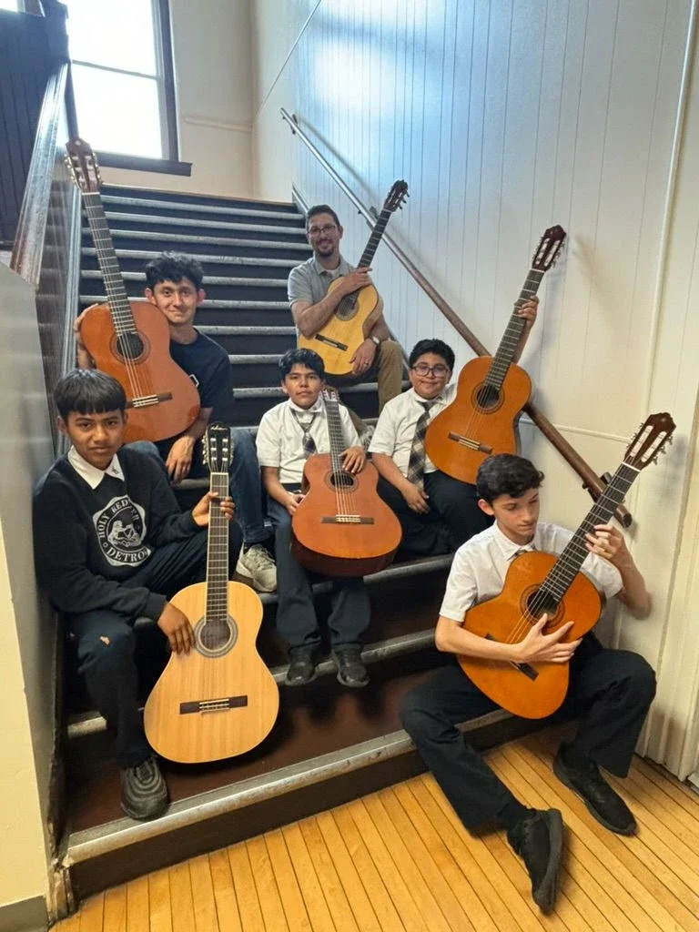 Here are some of our new Kithara Project Detroit guitar program students with the our fabulous teacher, Tony DiMambro.